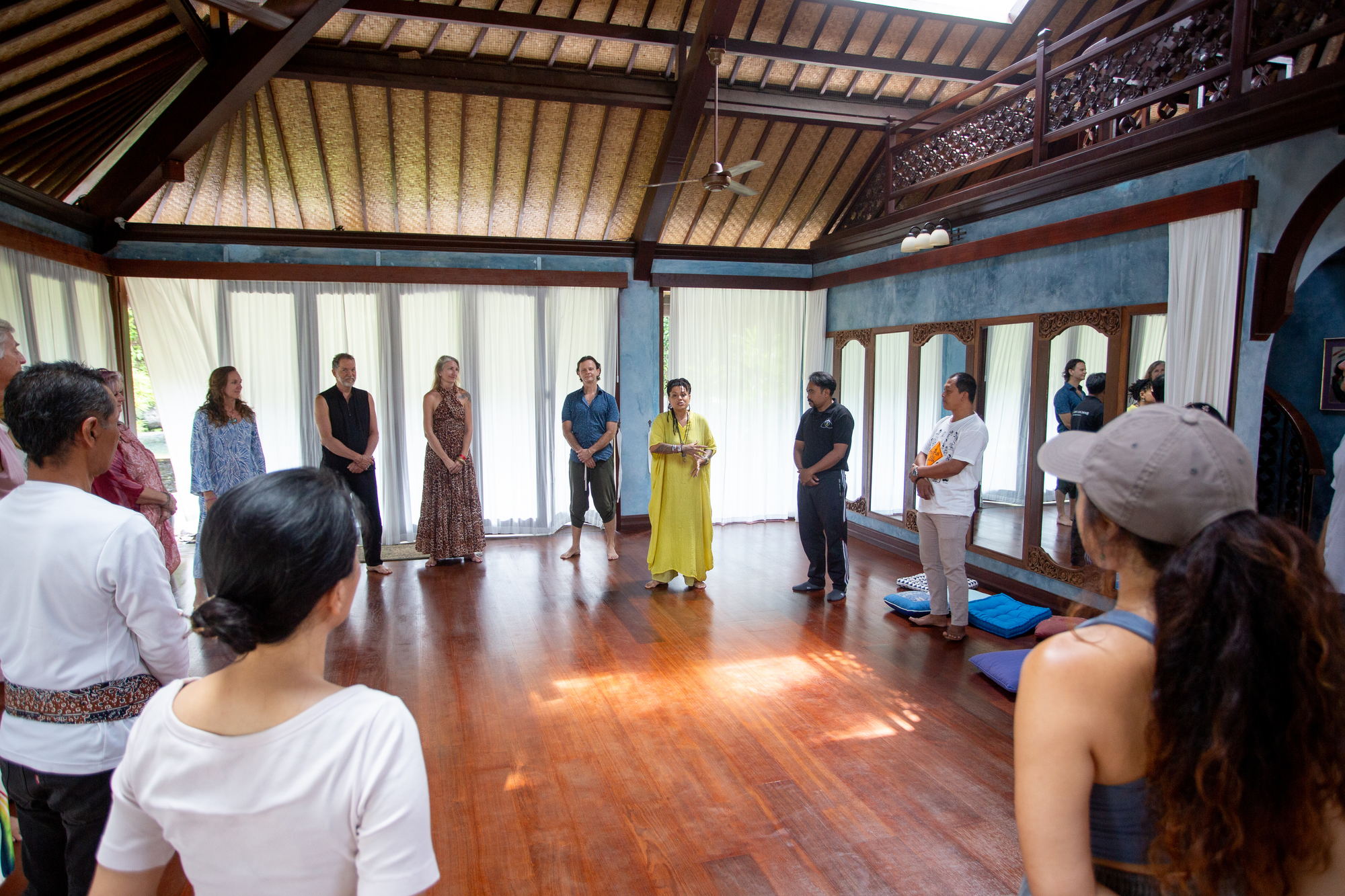 Participants standing in a wide circle