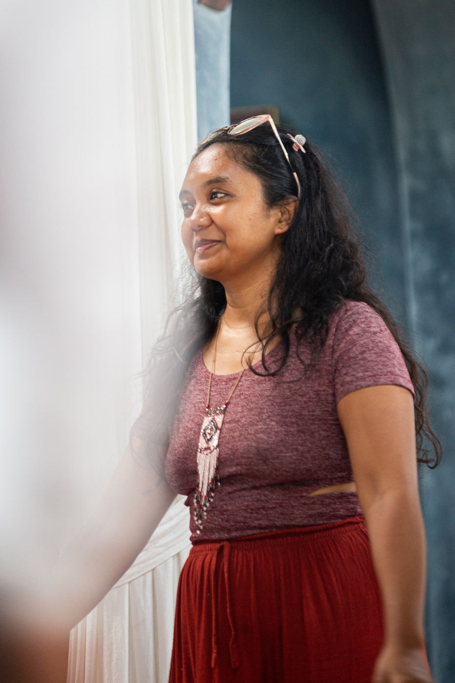 Participant smiling in the light of the pavilion