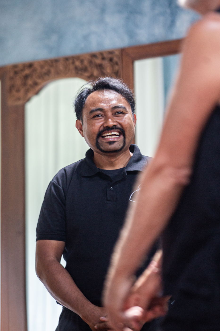 Participant smiling during the greeting round