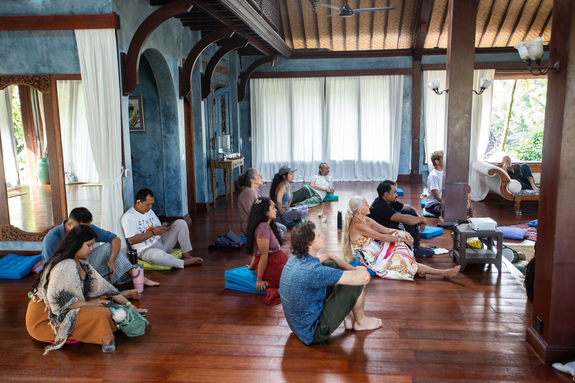 Seated group in conversation at Bhakti Marga